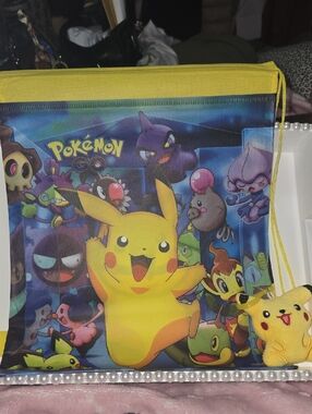 NEW..Pokémon Pikachu Drawstring Backpack - Yellow & Multicolor With Bag Charm